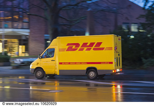 Germany  Grevenbroich  DHL transporter on rainy street