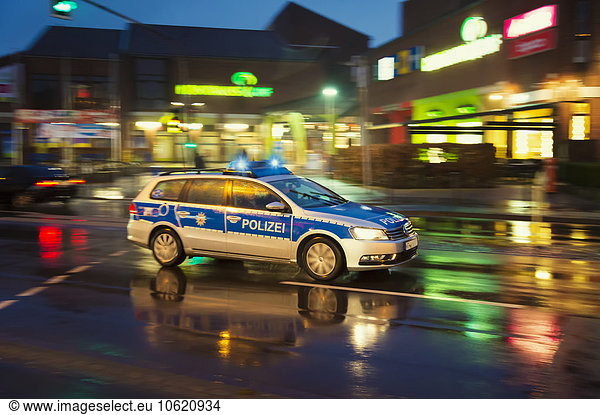 Germany  Grevenbroich  Police car on rainy street