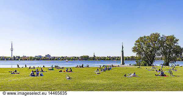 Germany  Hamburg  Alster Lake  people relaxing on lawn