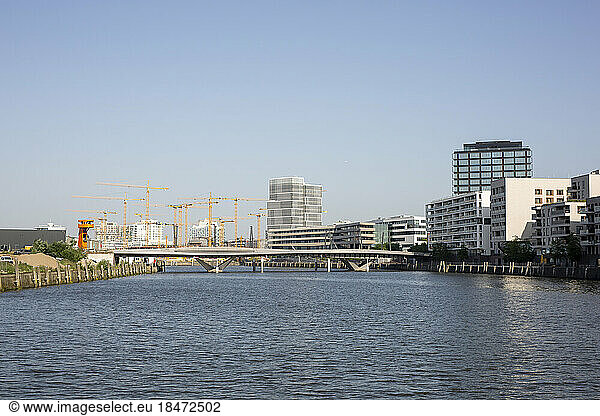 Germany  Hamburg  Elbe river flowing through HafenCity with bridge and large construction site in background