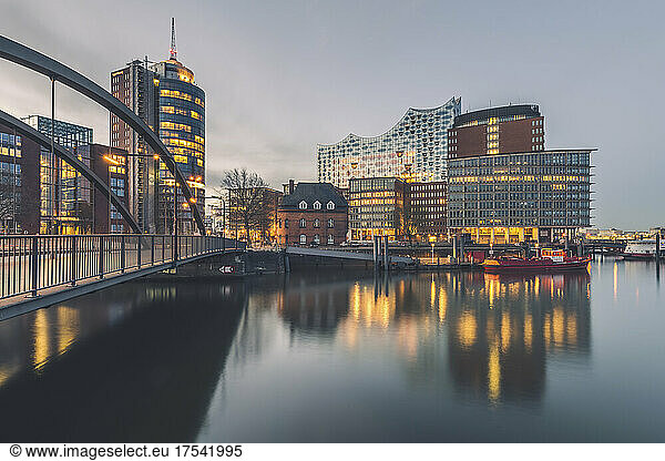 Germany  Hamburg  Long exposure of HafenCity waterfront with Elbphilharmonie in background