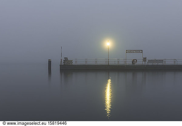 Germany  Hamburg  Outer Alster Lake jetty shrouded in thick fog