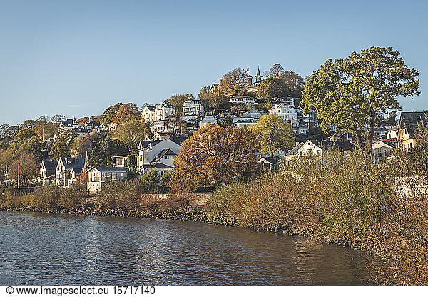 Germany  Hamburg  Suburb residences along bank of Elbe river in autumn