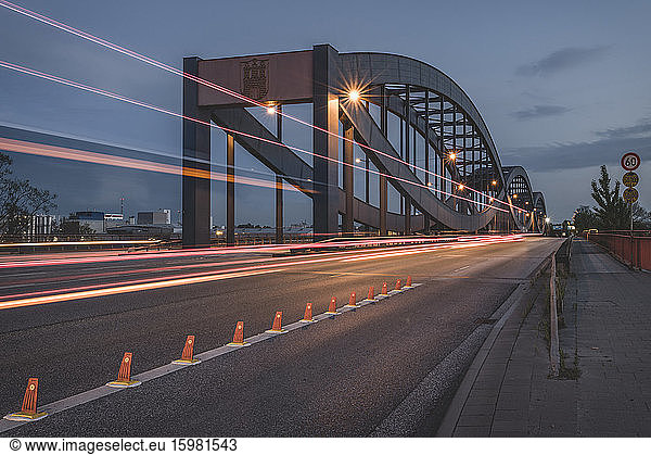 Germany  Hamburg  Vehicle light trails along Elbbrucken at dusk
