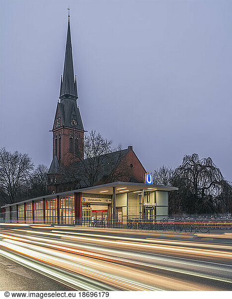 Germany  Hamburg  Vehicle light trails in front of Christuskirche at dusk
