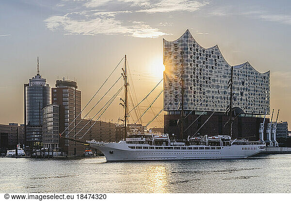 Germany  Hamburg  Windjammer moored in front of Elbphilharmonie at sunset