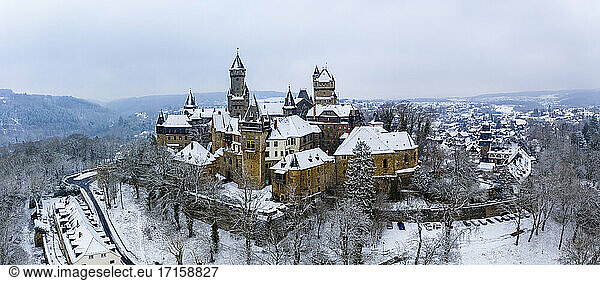 Germany  Hesse  Braunfels  Helicopter panorama of Braunfels Castle and surrounding town in winter