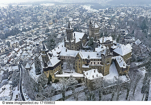 Germany  Hesse  Braunfels  Helicopter view of Braunfels Castle and surrounding town in winter