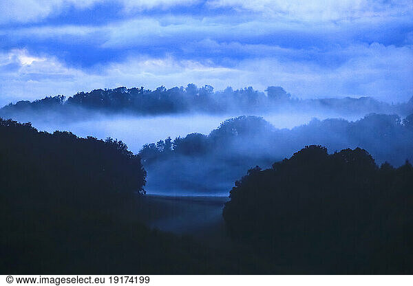 Germany  Hesse  Fog floating over Edersee lake at dusk