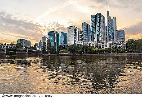 Germany  Hesse  Frankfurt  Bank of river Main and Mainhattan skyline at sunset