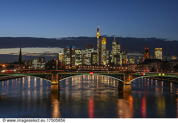 Germany  Hesse  Frankfurt  Ignatz Bubis Bridge at night with illuminated downtown skyline in background