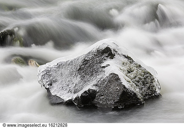 Germany  Hesse  Ice on rock in river