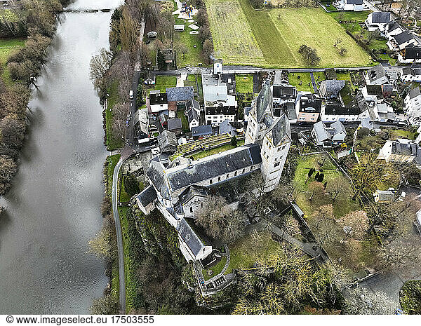 Germany  Hesse  Limburg an der Lahn  Dietkirchen  Helicopter view of river Lahn and Church of Saint Lubentius
