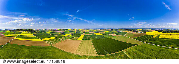 Germany  Hesse  Munzenberg  Helicopter panorama of green and yellow countryside fields in summer