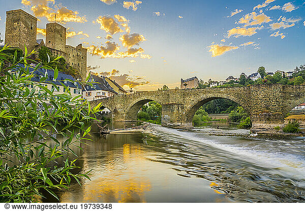 Germany  Hesse  Runkel  Stone arch bridge over river Lahn at sunset