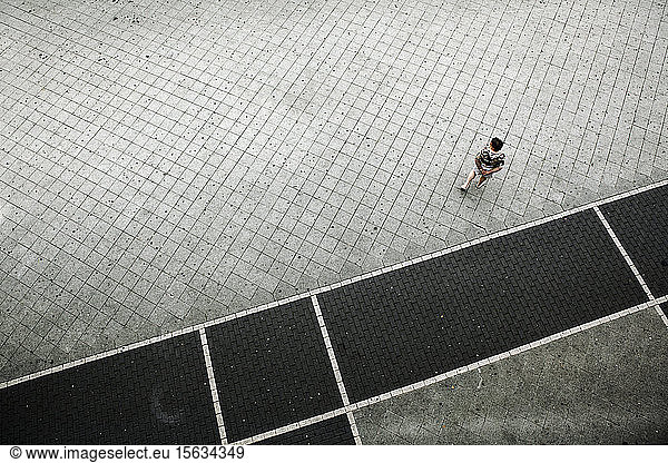 Germany  Hessen  Offenbach  person walking on sidewalk