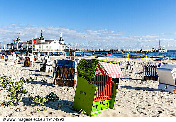 Germany  Mecklenburg-Vorpommern  Ahlbeck  Hooded beach chairs with bathhouse in background