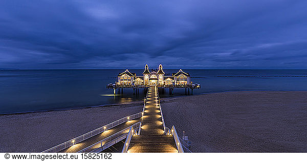Germany  Mecklenburg-West Pomerania  Ruegen Island  Sellin  Illuminated pier on sea at dusk