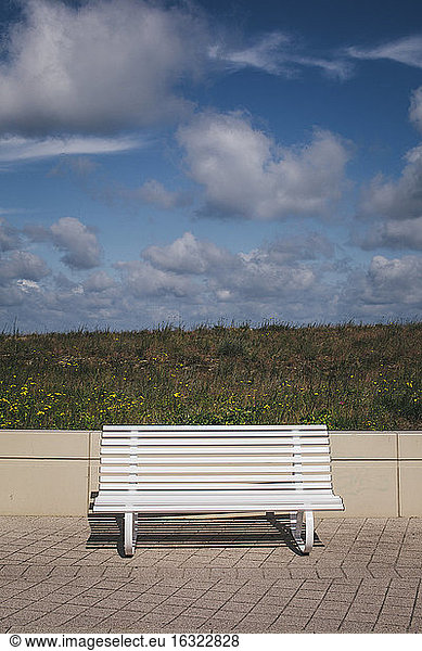 Germany  Mecklenburg-Western Pomerania  Warnemuende  white bench on promenade