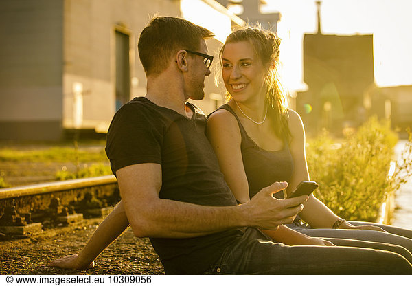 Germany Muenster couple in love face to face at backlight