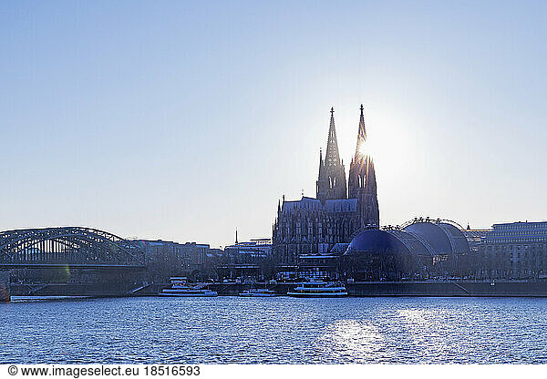 Germany  North Rhine Westphalia  Cologne  Cologne Cathedral and Rhine river at sunset