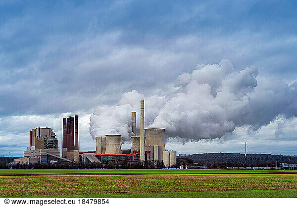 Germany  North Rhine Westphalia  Grevenbroich  Water vapor rising from cooling towers of lignite-fired power station