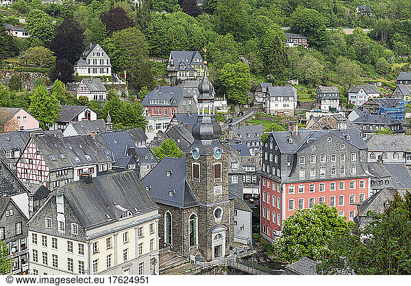 Germany  North Rhine-Westphalia  Monschau  View of medieval town in spring with church and Rotes Haus museum in center