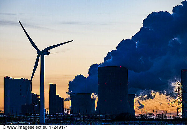 Germany  North Rhine Westphalia  Niederaussem  Wind turbine with lignite power station in background