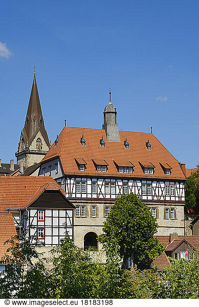 Germany  North Rhine-Westphalia  Warburg  Half-timbered town hall with church bell tower in background