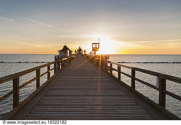 Germany  Ruegen  Sellin  sea bridge with submarine gondola and attendant's tower at sunrise
