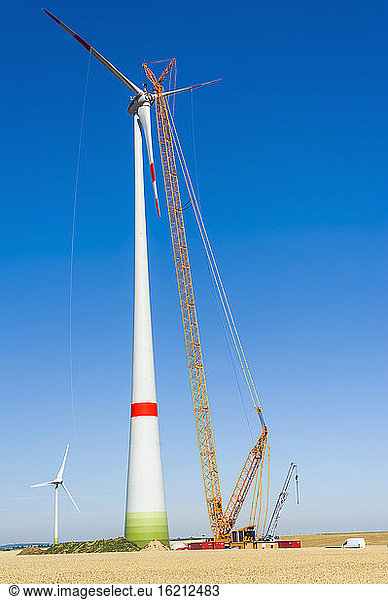Germany  Saxony  Cnstruction of wind turbine with crane