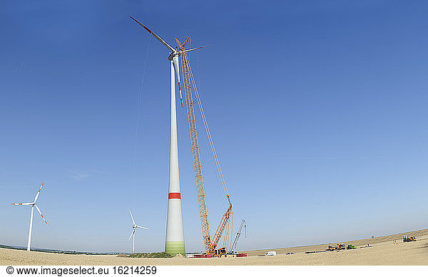 Germany  Saxony  Cnstruction of wind turbine with crane