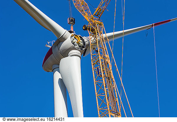 Germany  Saxony  Construction of wind turbine with crane