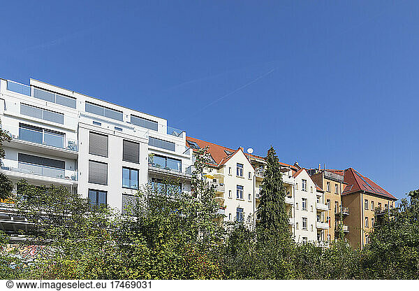 Germany  Saxony  Leipzig  Clear blue sky over row of new and old apartment buildings