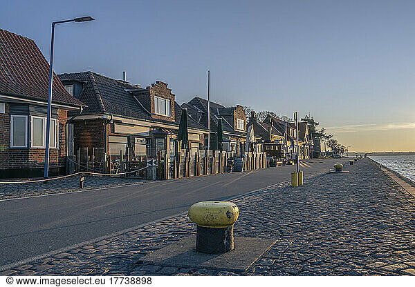 Germany  Schleswig-Holstein  Kiel  Row of beachside houses at dawn