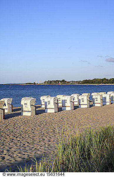 Germany  Schleswig-Holstein  Niendorf  Strandkorb beach-chairs on sandy coastal beach