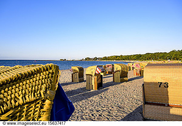 Germany  Schleswig-Holstein  Niendorf  StrandkorbÂ beach-chairsÂ on sandy coastal beach