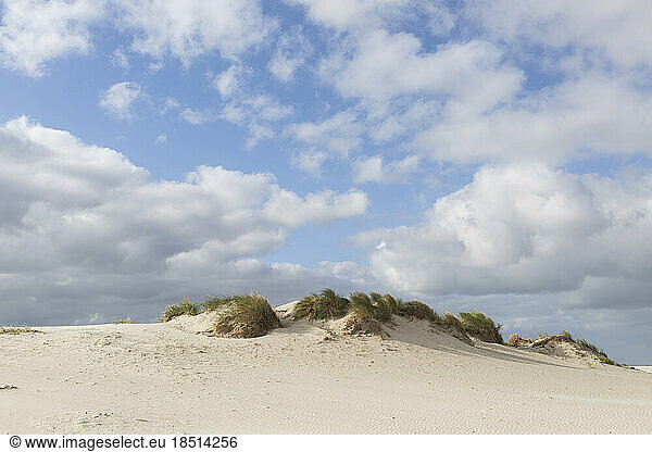 Germany  Schleswig-Holstein  St. Peter-Ording  Clouds floating over sand dune