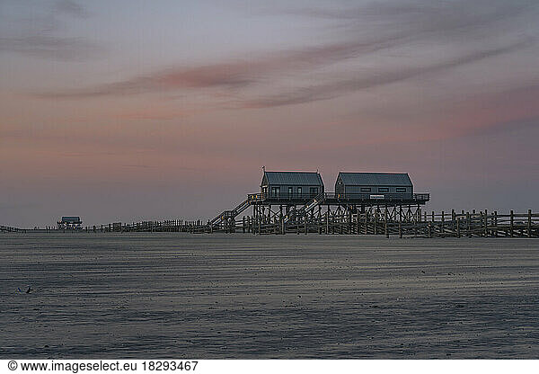 Germany  Schleswig-Holstein  St. Peter-Ording  Coastal stilt houses at dusk