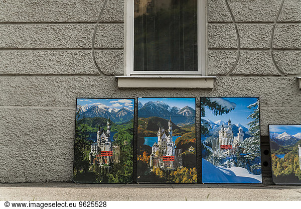 Germany  Schwangau  posters of Neuschwanstein Castle leaning at house front
