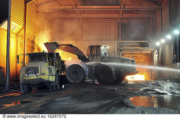 Germany  Steel mill  removal of slag with shovel excavator