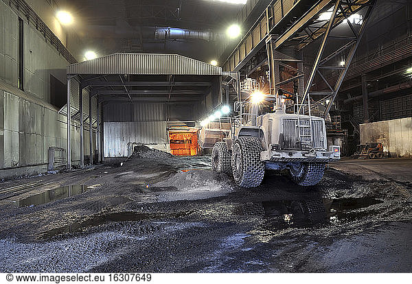 Germany  Steel mill  removal of slag with shovel excavator