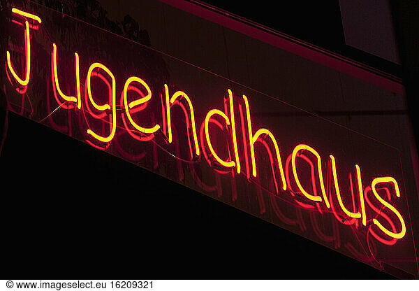 Germany  View of neon sign at a youth club  close up