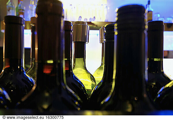 Germany  Wiesbaden  Glass bottles with alcohol in a night bar