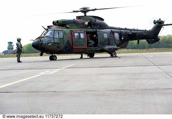 Gilze-Rijen  Netherlands. Military Cougar helicopter taking of and departing from an airbase platform.