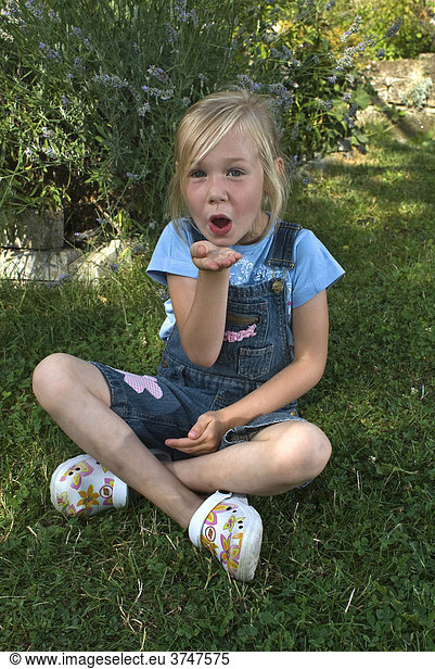Girl  5  blowing a kiss