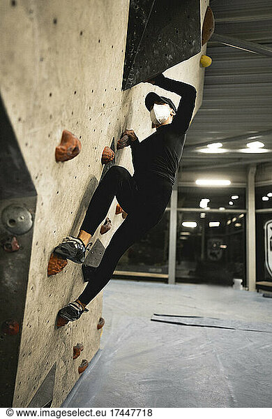 Girl climbing in a climbing gym