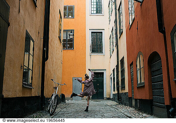 Girl dancing in the streets of Gamla Stan  Stockholm