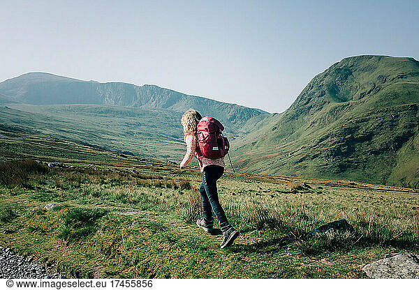 girl hiking up a mountain in Snowdonia National Park  Wales