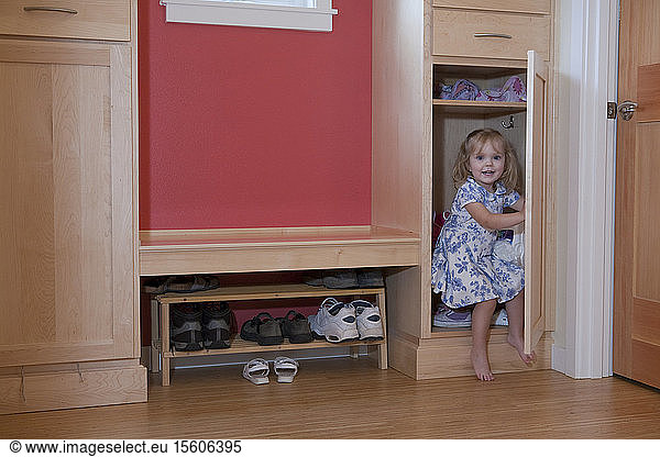 Girl in a closet of a disability accessible home